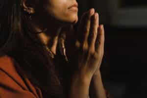 close up of woman praying