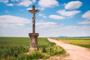 iron cross at the crossroads in countryside